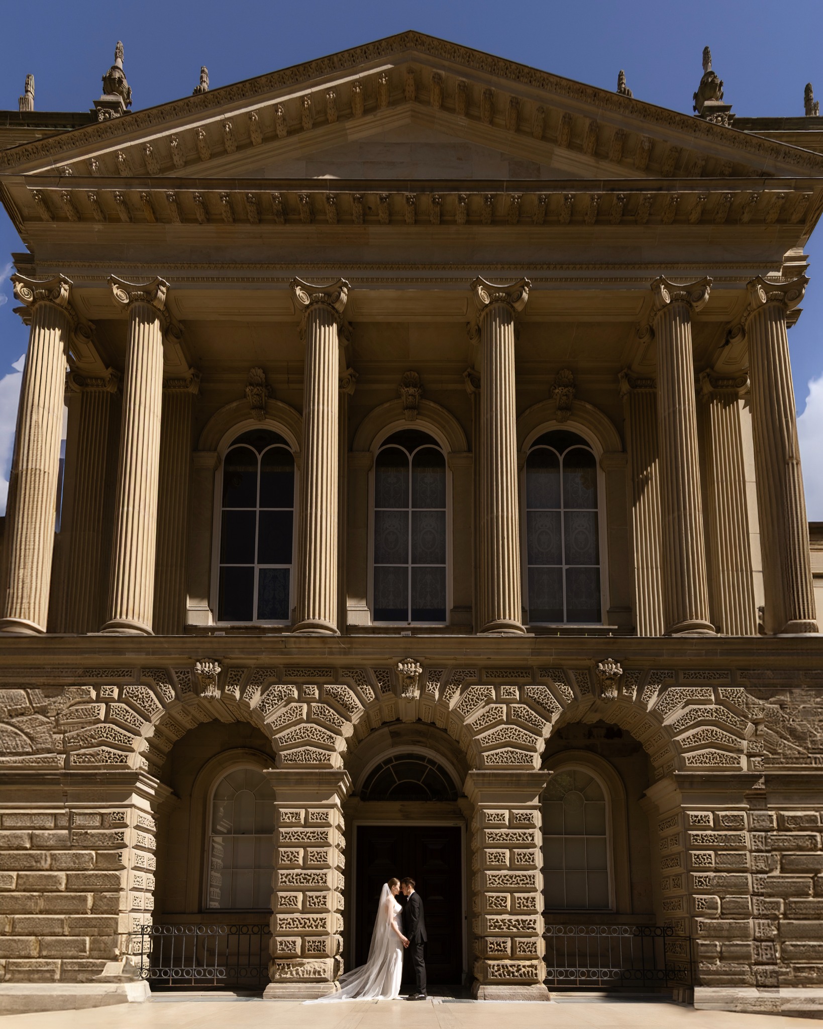 Grand exterior / couple at entrance